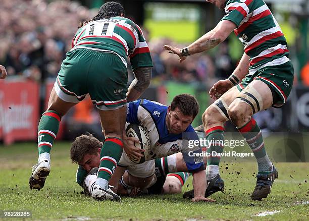 Lee Mears of Bath is tackled by Toby Flood during the Guinness Premiership match between Leicester Tigers and Bath at Welford Road on April 3, 2010...