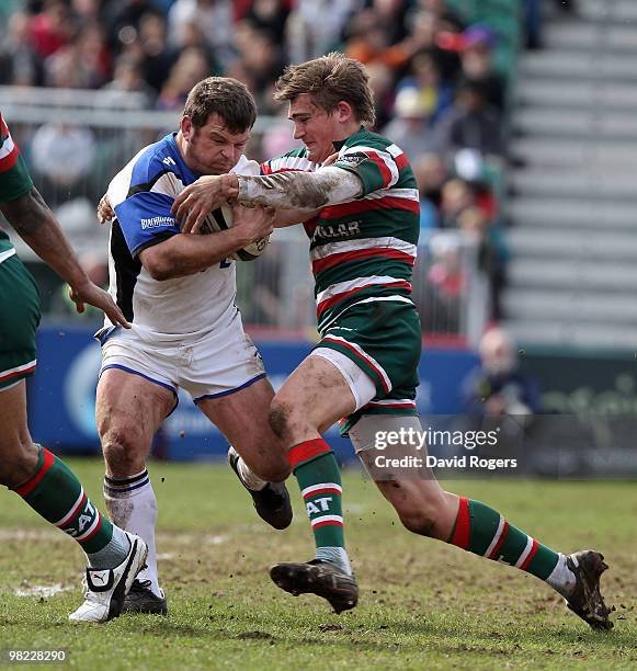 Lee Mears of Bath is tackled by Toby Flood during the Guinness Premiership match between Leicester Tigers and Bath at Welford Road on April 3, 2010...