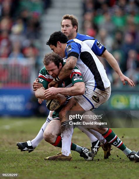 Geordan Murphy of Leicester is tackled by Shontayne Hape during the Guinness Premiership match between Leicester Tigers and Bath at Welford Road on...