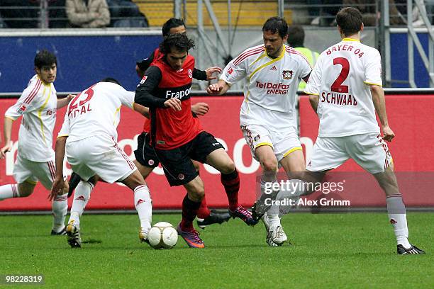 Halil Altintop of Frankfurt is challenged by Tranquillo Barnetta, Arturo Vidal, Manuel Friedrich, Daniel Schwaab of Leverkusen during the Bundesliga...