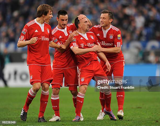 Franck Ribery of Bayern celebrates scoring his team's first goal with Ivica Olic, Holger Badstuber and Diego Contento during the Bundesliga match...