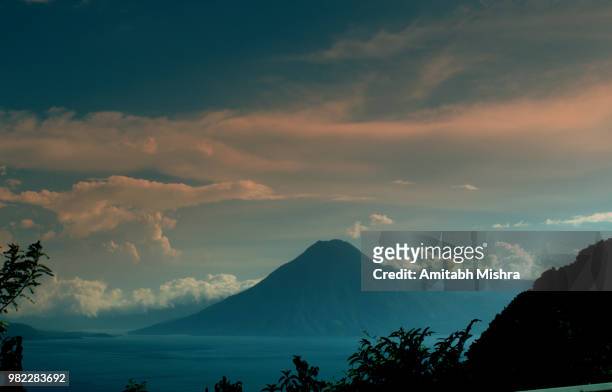 lake and volcano in panajachel, guatemala - panajachel stock pictures, royalty-free photos & images