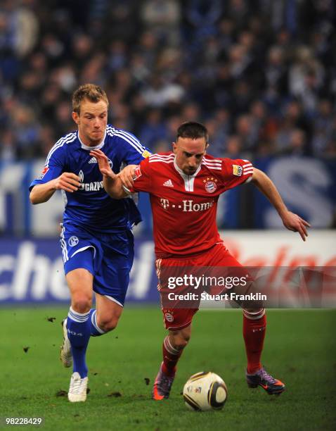 Ivan Rakitic of Schalke challenges Franck Ribery of Bayern during the Bundesliga match between FC Schalke 04 and FC Bayern Muenchen at the Veltins...