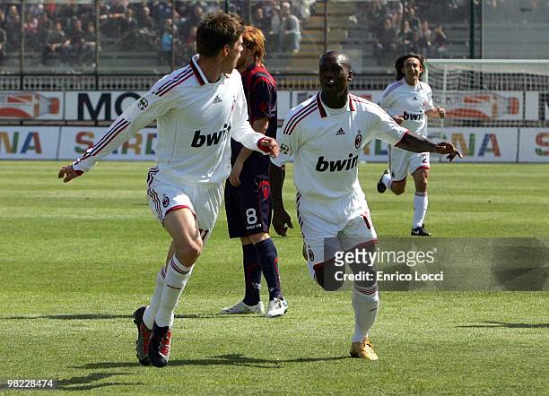 Klaas-Jan Huntelaar of Milan celebrates with Clarence Seedorf after scoring Milan's second goal during the Serie A match between Cagliari Calcio and...