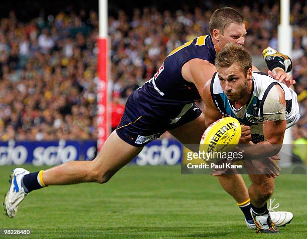 Brad Ebert of the Eagles tackles Tom Logan of the Power during the round two AFL match between the West Coast Eagles and Port Adelaide Power at...