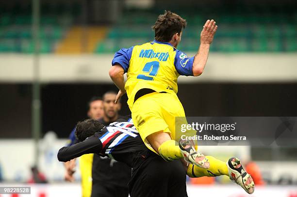 Santiago Morero of Chievo competes with Giampaolo Pazzini of Sampdoria during the Serie A match between AC Chievo Verona and UC Sampdoria at Stadio...