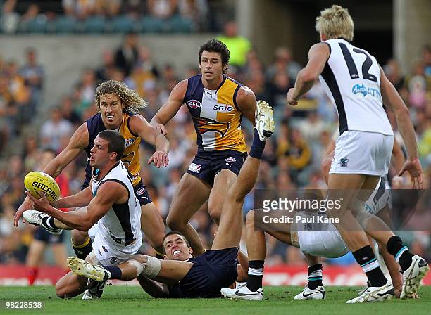 Travis Boak of the Power hand balls during the round two AFL match between the West Coast Eagles and Port Adelaide Power at Subiaco Oval on April 3,...