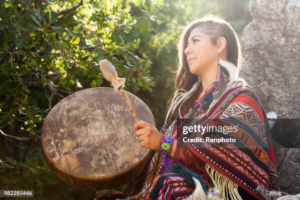 woman drumming - shaman stock pictures, royalty-free photos & images