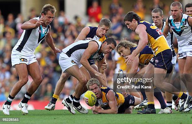 Adam Selwood of the Eagles handballs out of the pack during the round two AFL match between the West Coast Eagles and Port Adelaide Power at Subiaco...