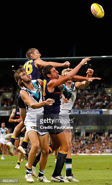Players contest the ball during the round two AFL match between the West Coast Eagles and Port Adelaide Power at Subiaco Oval on April 3, 2010 in...