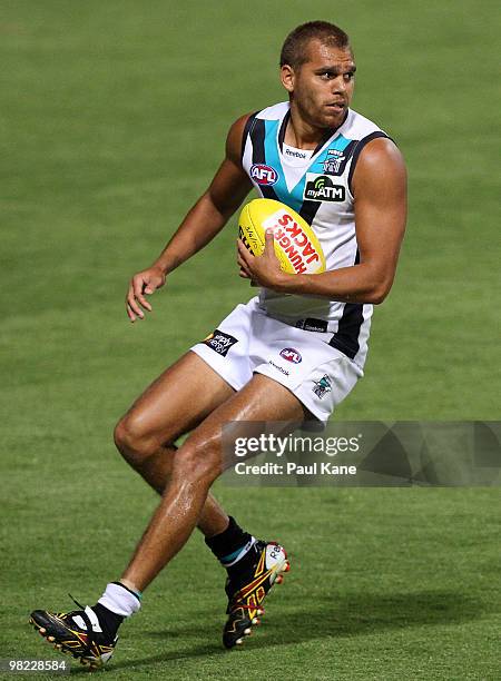 Nathan Krakouer of the Power looks for a pass during the round two AFL match between the West Coast Eagles and Port Adelaide Power at Subiaco Oval on...