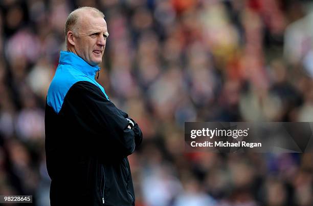Hull City Football Management Consultant Iain Dowie looks on during the Barclays Premier League match between Stoke City and Hull City at the...