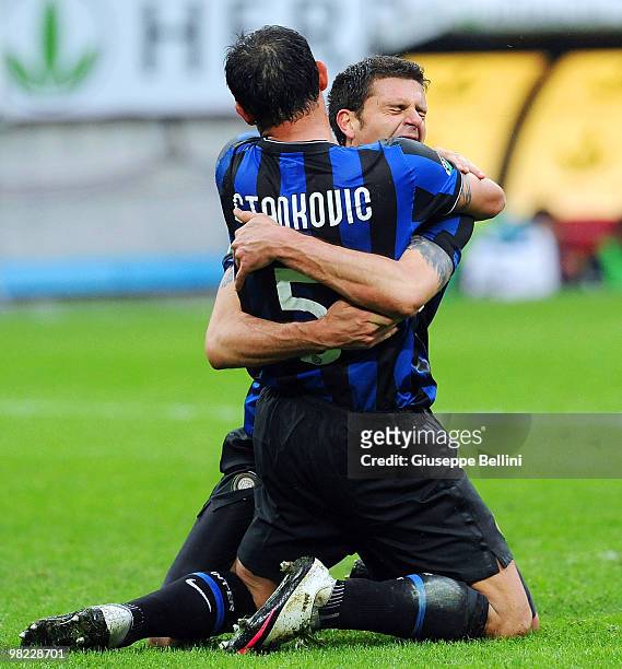 Thiago Motta of Inter celebrates with team mate Dejan Stankovic after scoring a goal during the Serie A match between FC Internazionale Milano and...