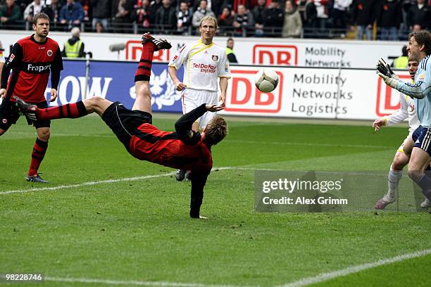 Maik Franz of Frankfurt scores his team's third goal against goalkeeper Rene Adler of Leverkusen during the Bundesliga match between Eintracht...