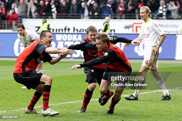 Sami Hyypiae of Leverkusen reacts as Maik Franz of Frankfurt celebrates his team's third goal with team mates Marco Russ and Alexander Meier of...