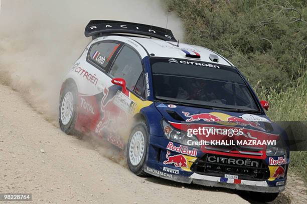 French driver Sebastien Loeb and his co-driver Daniel Elena compete in their Citroen C4 on the last day of the Jordan Rally in Amman on April 3,...