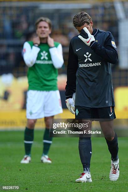 Tim Wiese and Clemens Fritz of Bremen look dejected after the Bundesliga match between Borussia Dortmund and SV Werder Bremen at Signal Iduna Park on...