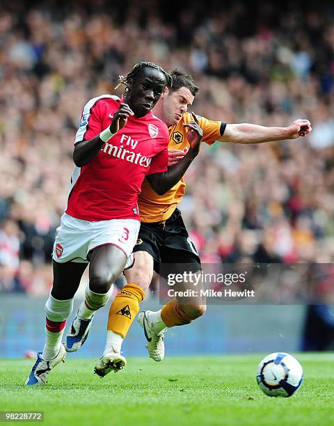 Bacary Sagna of Arsenal is challenged by Matthew Jarvis of Wolverhampton Wanderers during the Barclays Premier League match between Arsenal and...