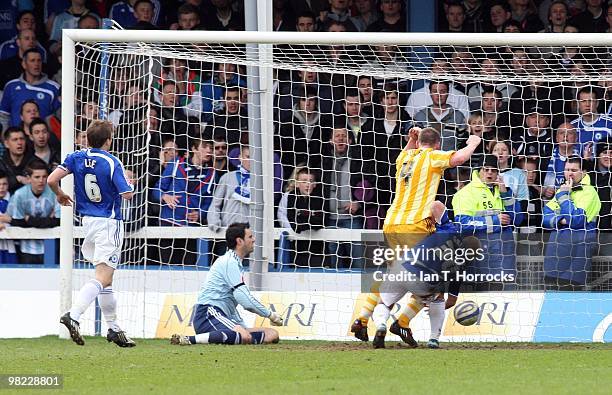 Kevin Nolan battles with Scott Griffiths to force Newcastle's equalizing goal during the Coca Cola Championship match between Peterborough United and...