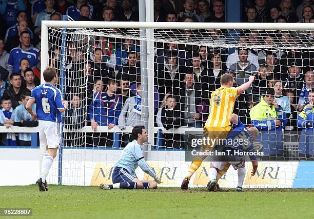 Kevin Nolan battles with Scott Griffiths to force Newcastle's equalizing goal during the Coca Cola Championship match between Peterborough United and...