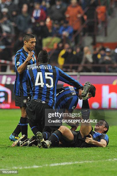 Inter Milan's Brazilian midfielder Thiago Motta celebrates after scoring with Inter Milan's Serbian midfielder Dejan Stankovic , Inter Milan's...
