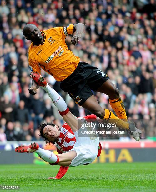 Tuncay of Stoke kicks George Boateng of Hull in the head and knocks him out during the Barclays Premier League match between Stoke City and Hull City...