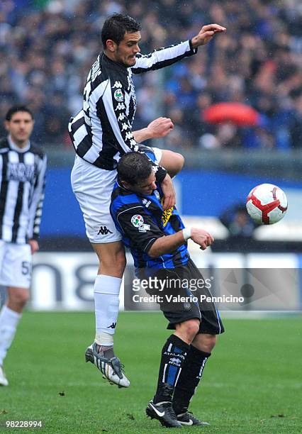 Simone Padoin of Atalanta BC clashes with Alexandros Tziolis of AC Siena during the Serie A match between Atalanta BC and AC Siena at Stadio Atleti...