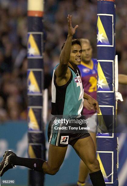 Che Cockatoo-Collins for Port Adelaide celebrates a goal in the Ansett Cup Grand Final between the Brisbane Lions and Port Power played at Football...