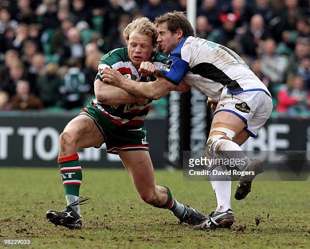 Scott Hamilton of Leicester is tackled by Butch James during the Guinness Premiership match between Leicester Tigers and Bath at Welford Road on...