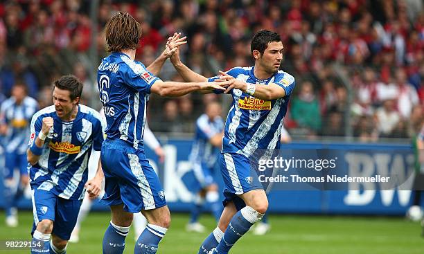 Anthar Yahia and Christian Fuchs of Bochum celebrating the goal of Christoph Dabrowski of Bochum during the Bundesliga match between SC Freiburg and...