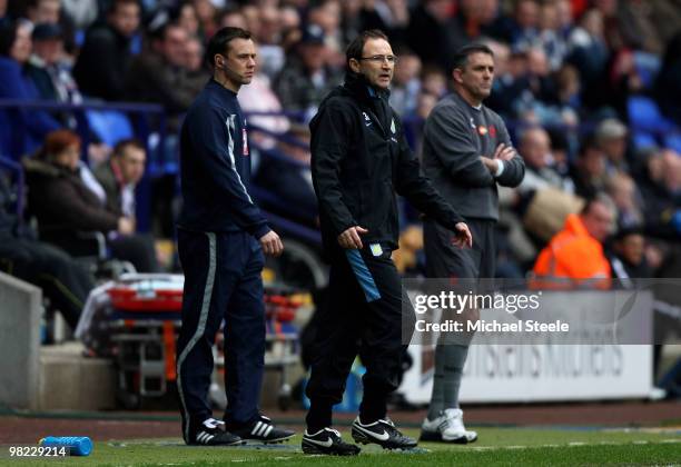 Martin O'Neill the Aston Villa manager watches his players alongside Owen Coyle the manager of Bolton during the Bolton Wanderers v Aston Villa...