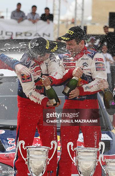 French driver Sebastien Loeb and his co-driver Daniel Elena celebrate their win at the end of the Jordan Rally in Amman on April 3, 2010. Loeb won...
