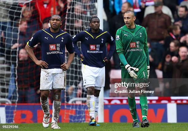 Wilson Palacios, Sebastien Bassong and Heurelho Gomes look dejected after conceding the third goal during the Barclays Premier League match between...