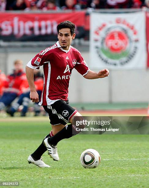 Ilkay Guendogan of Nuremberg runs with the ball during the Bundesliga match between 1. FC Nuernberg and FSV Mainz 05 and at Easy Credit Stadium on...