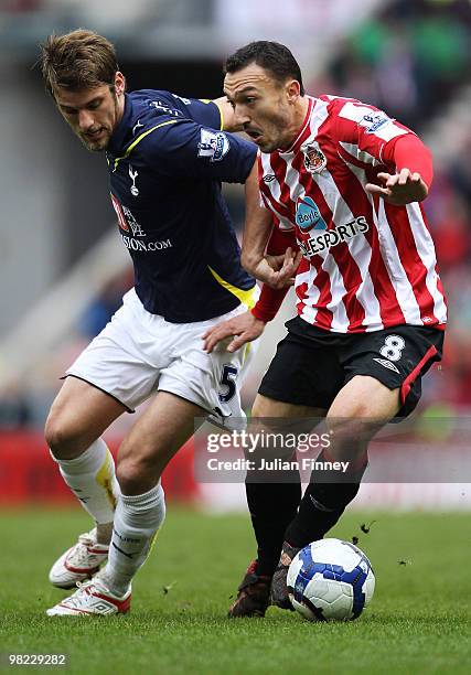 Steed Malbranque of Sunderland holds off David Bentley of Spurs during the Barclays Premier League match between Sunderland and Tottenham Hotspur at...