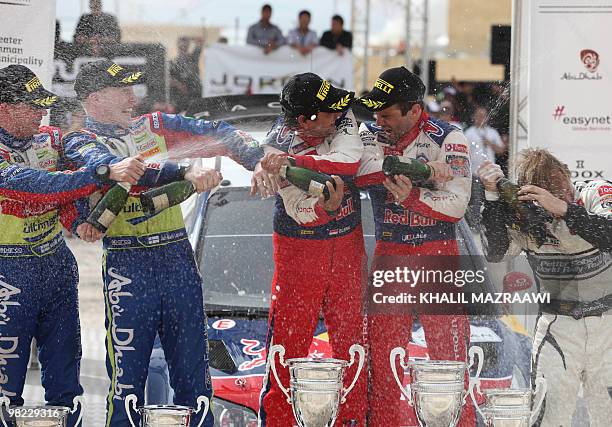 Winners of the FIA world championship in Jordan Frenchman Sebastien Loeb and his co-driver Daniel Elena , third placed Petter Solberg of Norway,...