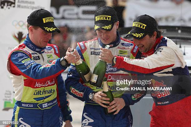 Second-placed winners of the FIA world championship in Jordan, Jari-Matti Latvala of Finland and co-driver Miikka Anttila celebrate with Daniel Elena...