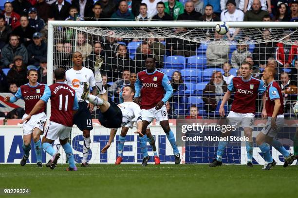 Gary Cahill of Bolton hits an overhead kick which went narrowly wide during the Bolton Wanderers and Aston Villa Barclays Premier League match at The...