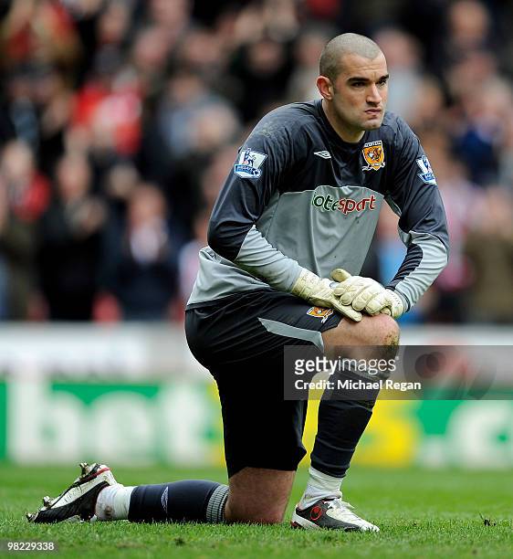 Boaz Myhill of Hull looks dejected after conceding a second goal during the Barclays Premier League match between Stoke City and Hull City at the...
