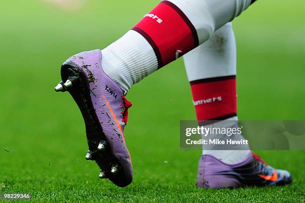 Theo Walcott of Arsenal wears personalised boots during the Barclays Premier League match between Arsenal and Wolverhampton Wanderers at the Emirates...