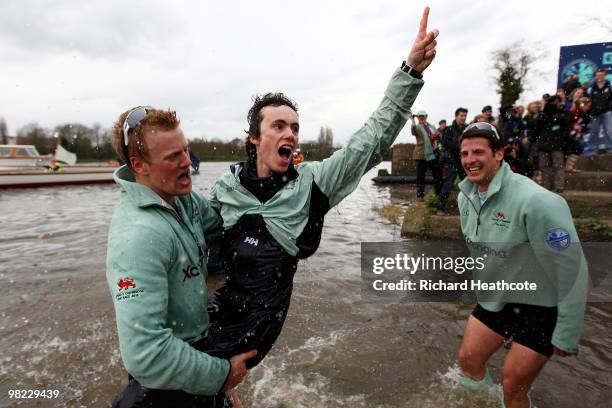 Cambridge Cox Ted Randolph celebrates victory with team mates after the 156th Oxford and Cambridge University Boat Race on the River Thames on April...
