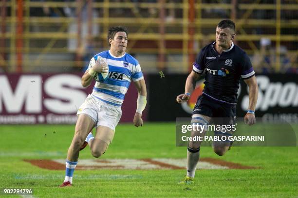 Sebastian Cancelliere from Argentina runs with the ball, during their international test match against Scotland, at the Centenario stadium, in...