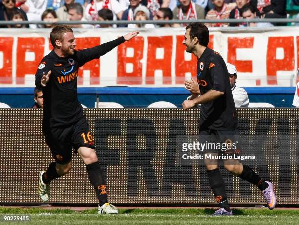 Mirko Vucinic of AS Roma celebrates his goal with Daniele De Rossi during the Serie A match between AS Bari and AS Roma at Stadio San Nicola on April...
