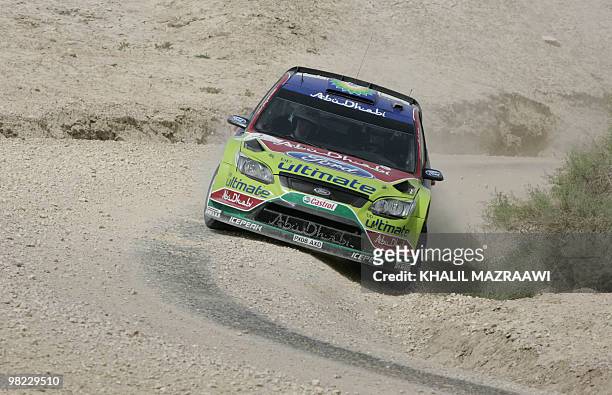 Finland's Jari-Martti Latvala and co-driver Miikka Anttila drive their Ford Focus WRC on the last day of the Jordan Rally in Amman on April 3, 2010....