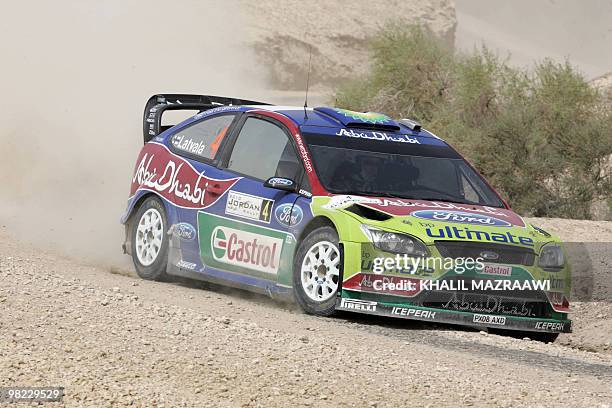 Finland's Jari-Martti Latvala and co-driver Miikka Anttila drive their Ford Focus WRC on the last day of the Jordan Rally in Amman on April 3, 2010....