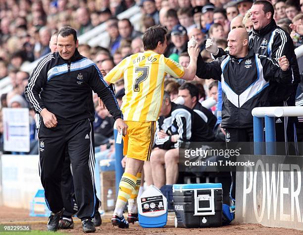 Joey Barton celebrates with the Newcastle bench after scoring Newcastle's second goal during the Coca Cola Championship match between Peterborough...