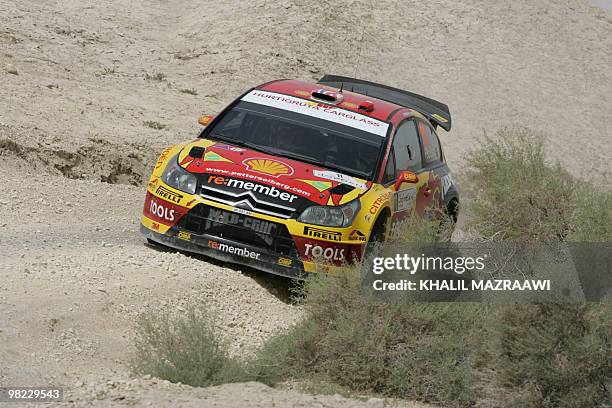 Petter Solberg of Norway and his co-driver Phil Mills of Britain drive their Citroen C4 WRC on the last day of the Jordan Rally in Amman on April 3,...