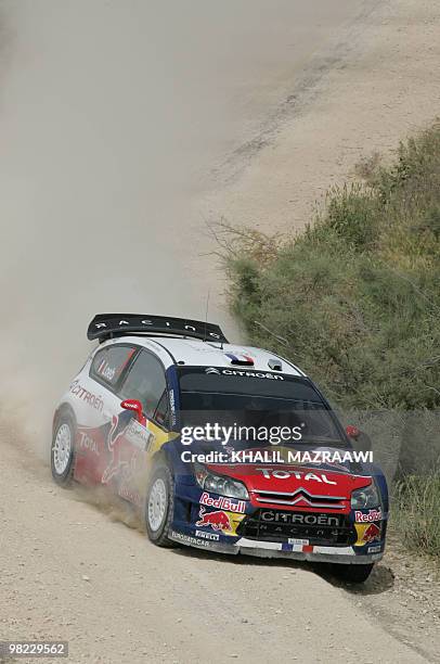 French driver Sebastien Loeb and his co-driver Daniel Elena compete in their Citroen C4 on the last day of the Jordan Rally in Amman on April 3,...