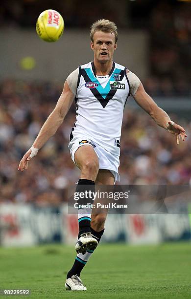 Dean Brogan of the Power kicks the ball during the round two AFL match between the West Coast Eagles and Port Adelaide Power at Subiaco Oval on April...