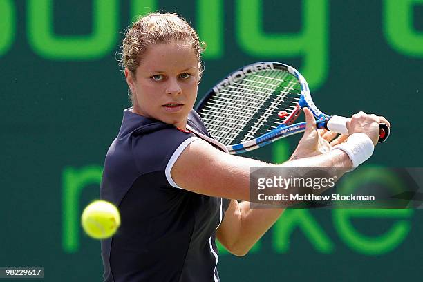 Kim Clijsters of Belgium returns a shot against Venus Williams of the United States during the women's final of the 2010 Sony Ericsson Open at...